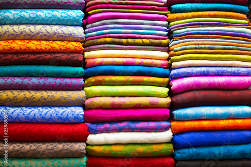 Many colorful material silk on the market. Very popular and traditional souvenir from Vietnam.