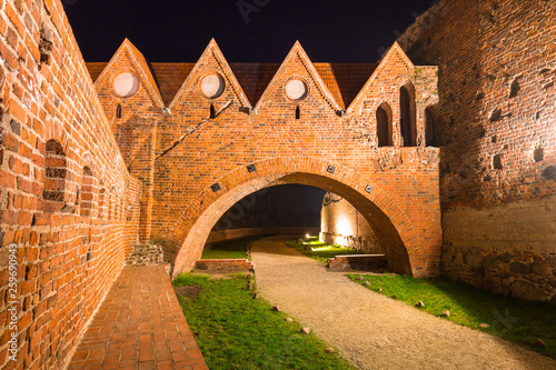 Ruins of the Teutonic knights castle in Torun at night, Poland