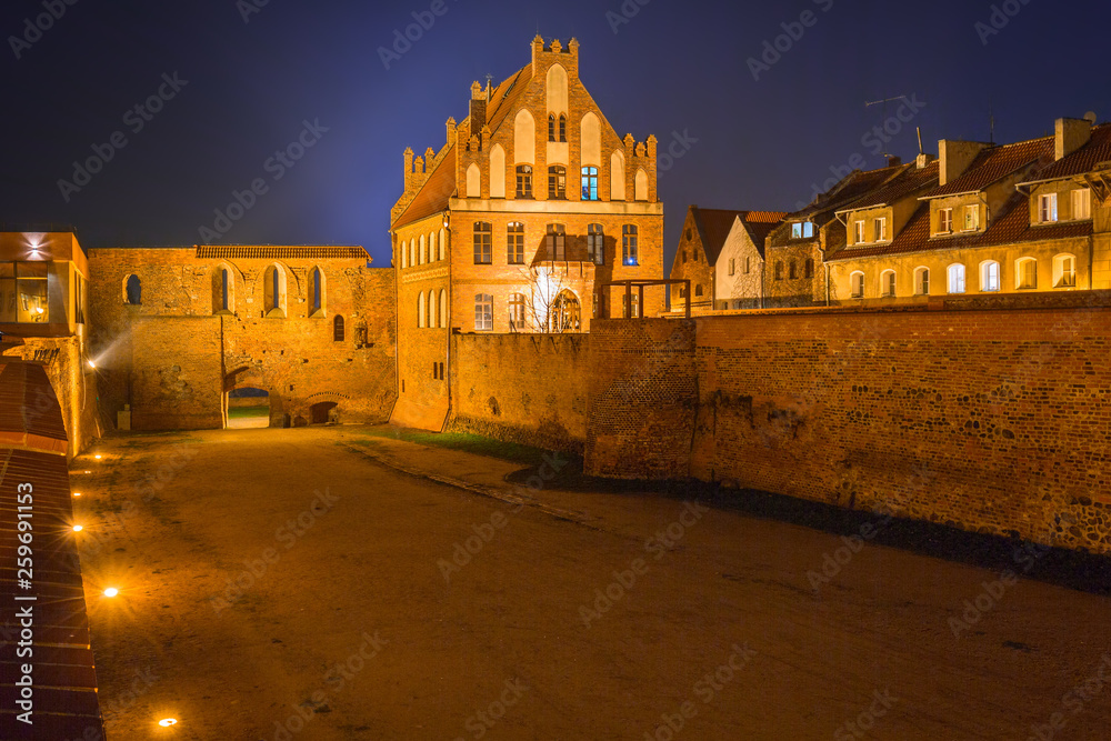 Ancient city walls of Torun at night, Poland