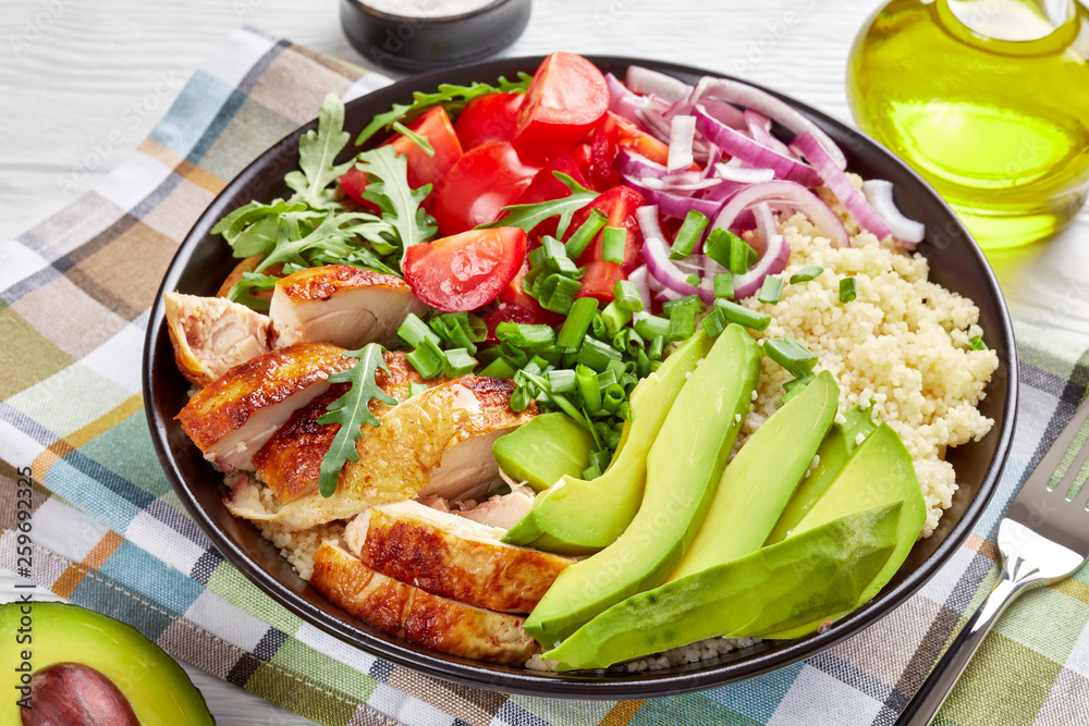 grilled chicken salad in a bowl, close-up grilled chicken salad in a bowl, close-up