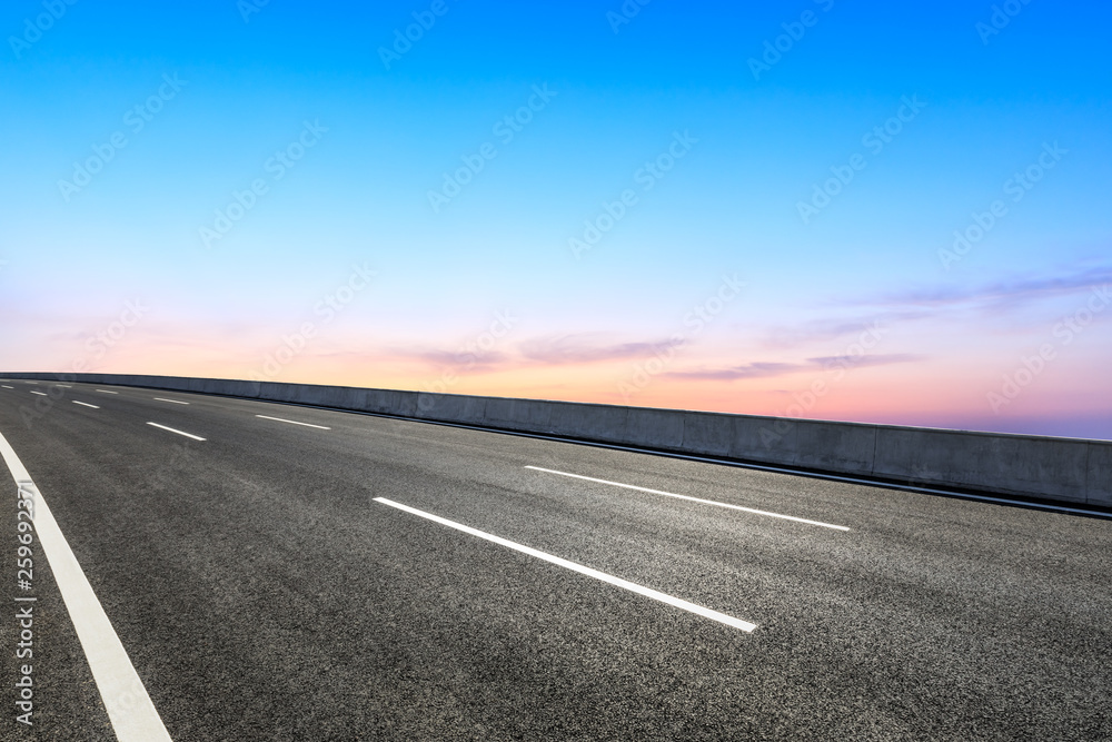 Empty asphalt road and beautiful sky clouds at sunset Empty asphalt road and beautiful sky clouds at sunset