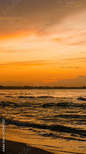 Deserted beach of the sea at dawn or sunset