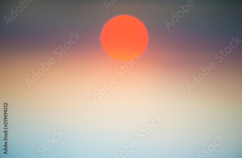 Abstract blurred view of sky and sunset sun. Can be used as nature background
