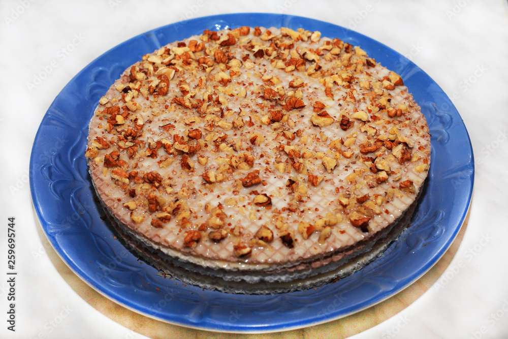 Waffle cake with condensed milk and walnuts