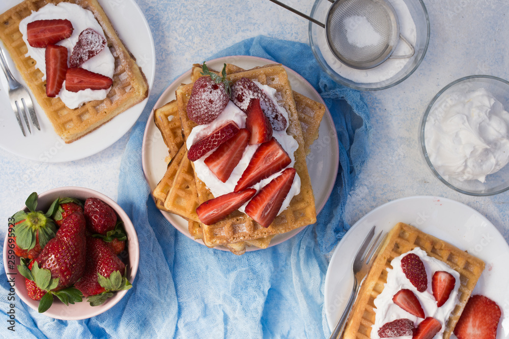 Waffles with strawberries and whipped cream Waffles with strawberries and whipped cream