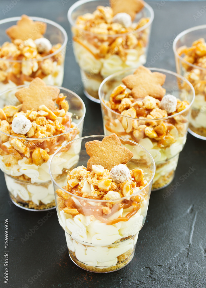 dessert in a glass with caramel and nuts dessert in a glass with caramel and nuts