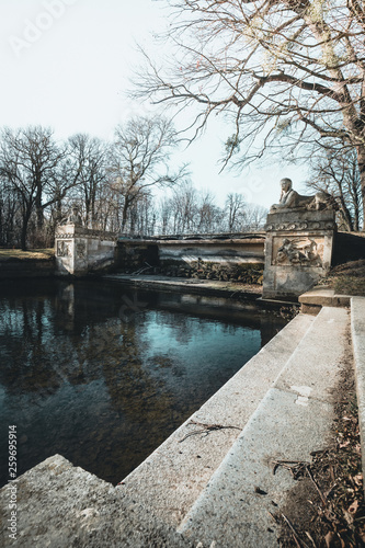 View on Franzensburg castle in Laxenburg town in Austria. Long exposure effect with glossy water and reflection.