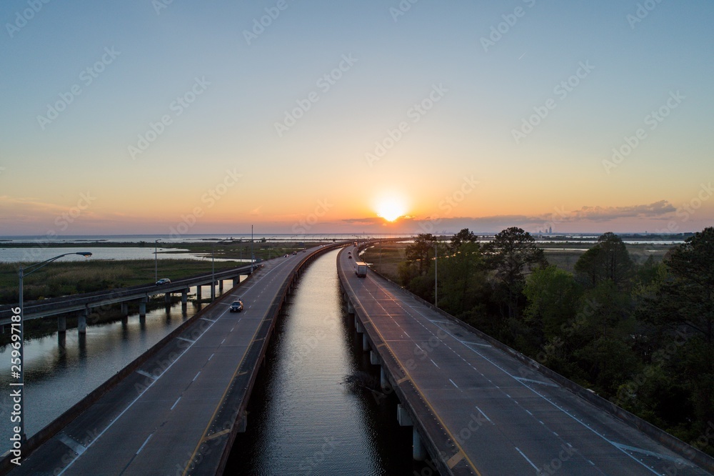 Fototapeta premium Aerial view of Mobile Bay at sunset