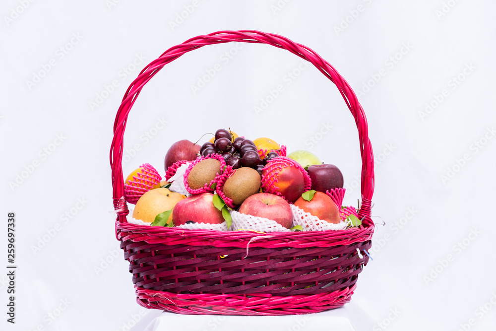 Fruit group in basket on white background,