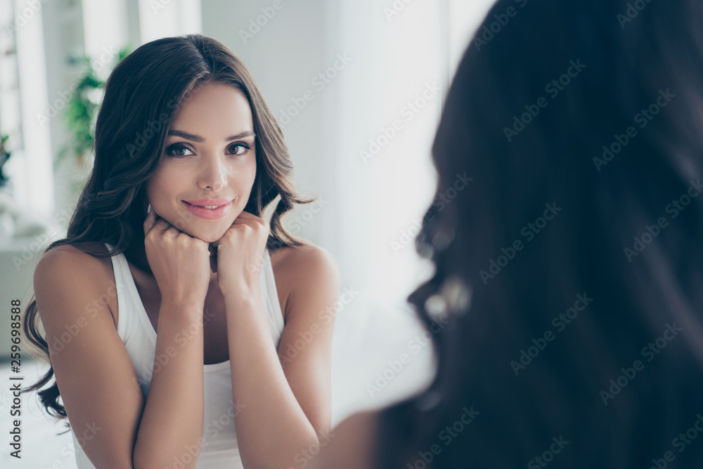 Close-up portrait of her she nice-looking sweet tender gentle attractive fascinating charming cute feminine shine well-groomed wavy-haired lady looking at mirror in light white interior room Close-up portrait of her she nice-looking sweet tender gentle attractive fascinating charming cute feminine shine well-groomed wavy-haired lady looking at mirror in light white interior room