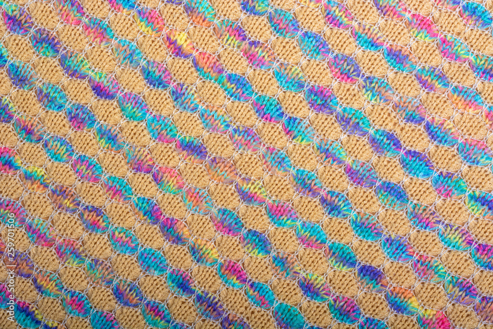 Abstract background. Colored knitted fabric texture, diagonal lines, flat lay