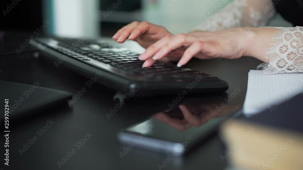 Female Hands Typing on a PC keyboard in an Office Female Hands Typing on a PC keyboard in an Office