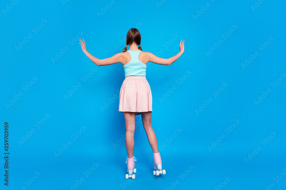 Full length back rear behind body size view photo she her lady hide face stand turned legs vintage rollers activity way life wear casual street summer pastel dress clothes isolated blue background Full length back rear behind body size view photo she her lady hide face stand turned legs vintage rollers activity way life wear casual street summer pastel dress clothes isolated blue background