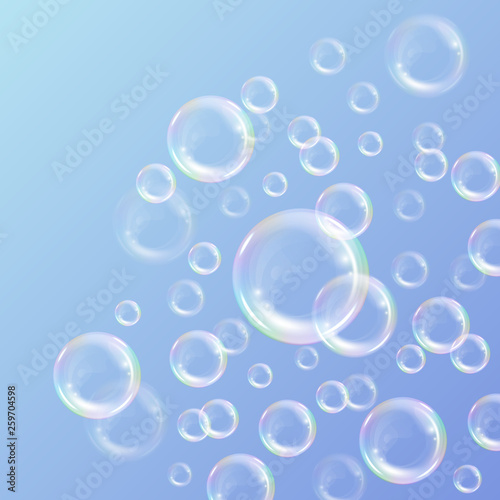 Realistic transparent floating soap bubbles with rainbow reflection. Design element for advertising booklet  flyer or poster