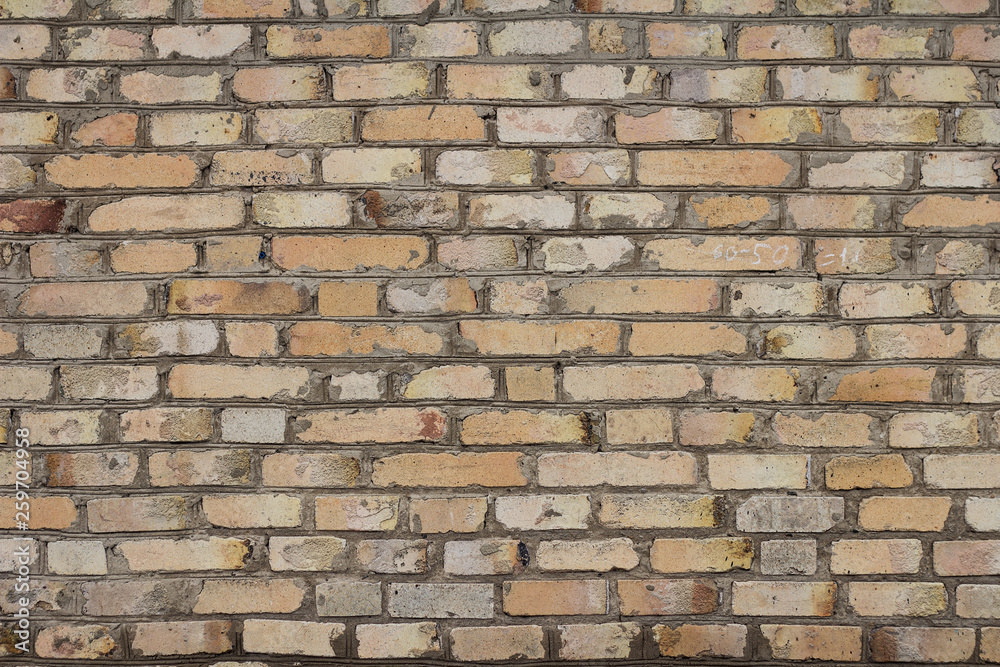 Fototapeta premium The brick texture, wall, with cracks and scratches can be used as a background
