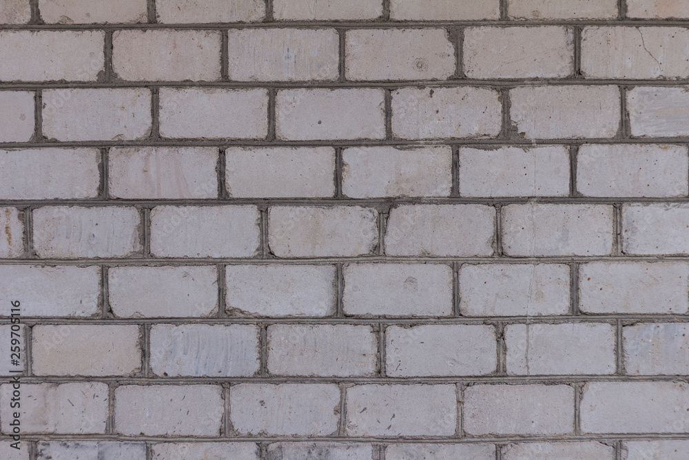 The brick texture, wall, with cracks and scratches can be used as a background The brick texture, wall, with cracks and scratches can be used as a background