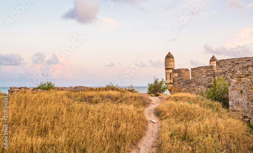 Ruins of  ancient fortress by  sea photo