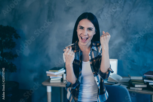 Close-up portrait of her she nice-looking ecstatic attractive charming lovely cheerful cheery brunette lady in checked shirt rejoicing at industrial loft style interior work place station