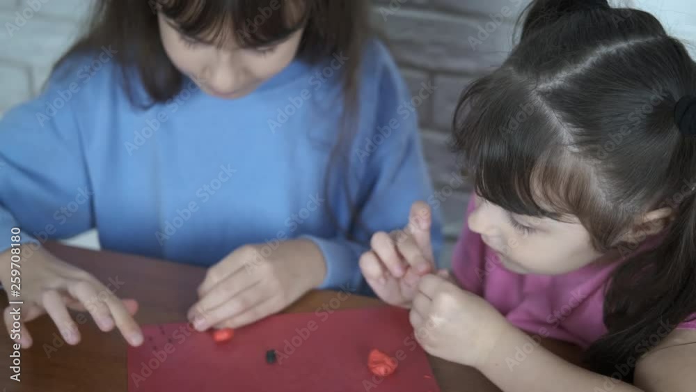 Child development. Little girls sculpt plasticine. Child development. Little girls sculpt plasticine.