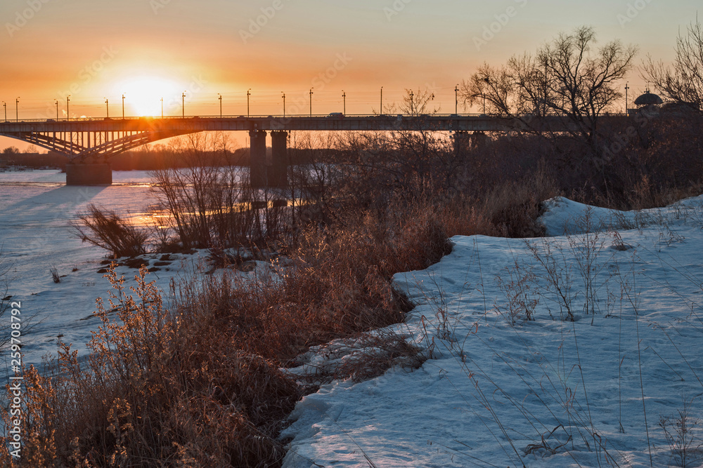 sunset over the river in winter