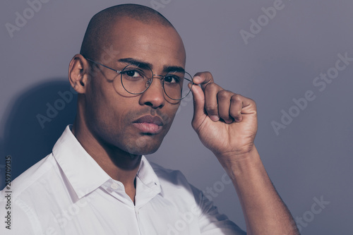 Close up side profile photo beautiful amazing dark skin he him his macho manager employer collar financier boss chief arm hand hold specs shaved face wear white shirt isolated grey background