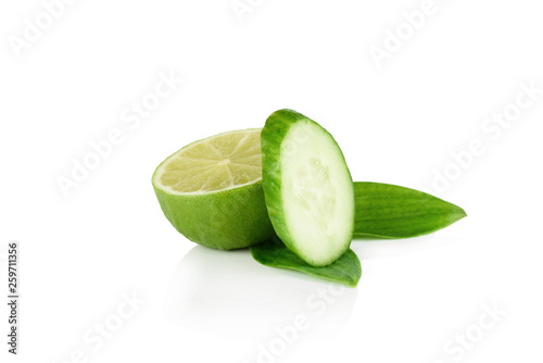 Fresh cucumber and lime on white background