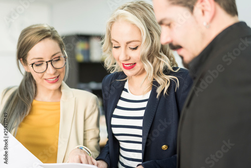 Partners working in office looking papers in office