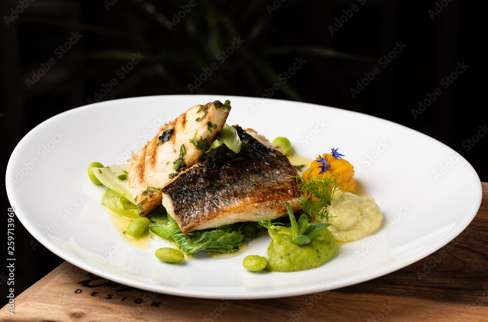 Grilled sea bass fillet with ginger, fresh peppers and pak choy / Fusion food Grilled sea bass fillet with ginger, fresh peppers and pak choy / Fusion food