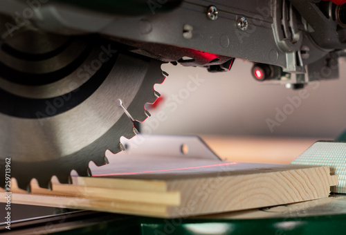  Modern electric circular saw in the workshop