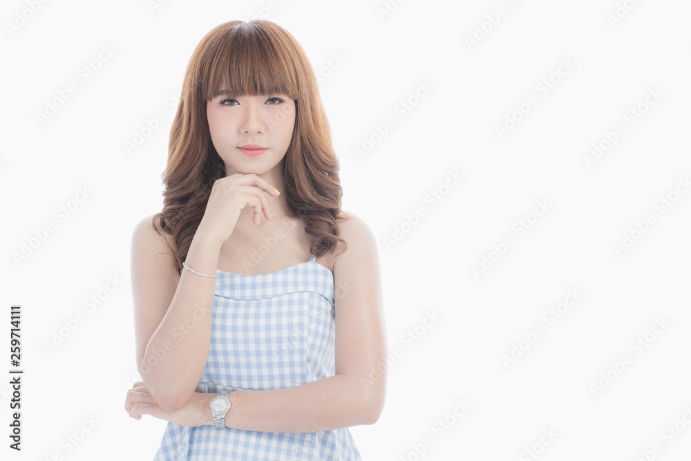 Front view close-up portrait of young beautiful Asian woman with curly long dark brown hair in light blue checked dress stand up straight isolated white background Front view close-up portrait of young beautiful Asian woman with curly long dark brown hair in light blue checked dress stand up straight isolated white background