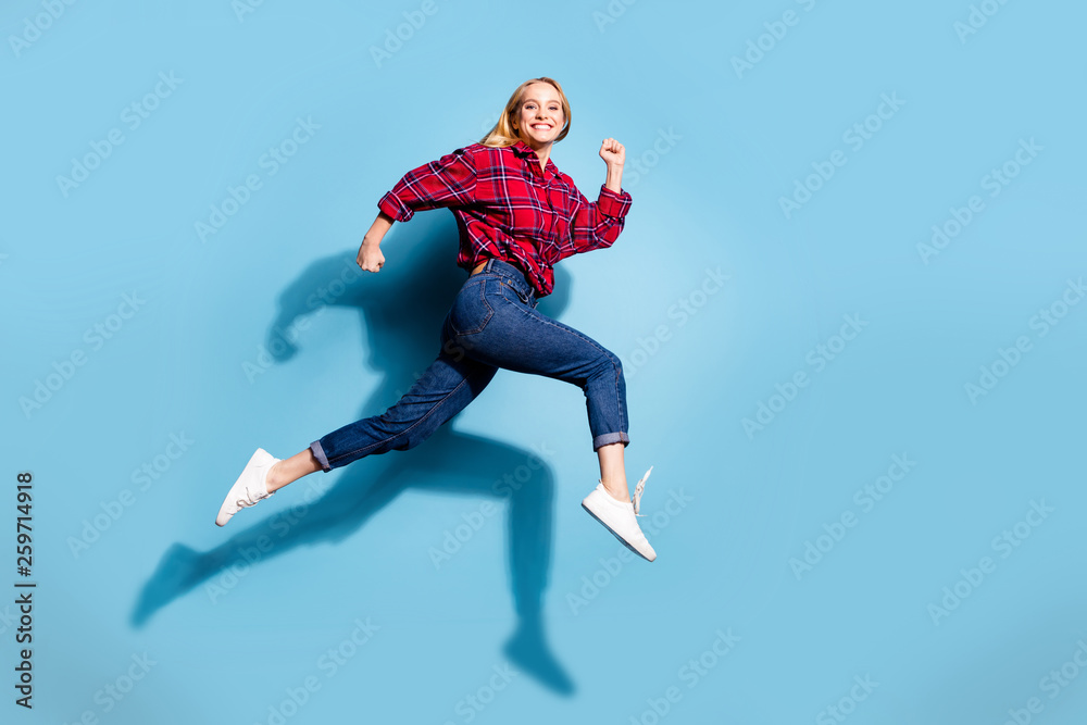 Full length body size profile side view portrait of nice charming attractive cheerful cheery girl wearing checked shirt having fun isolated on teal turquoise bright vivid shine background