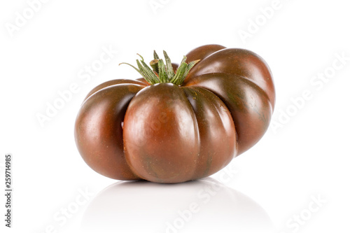 One whole glossy fresh tomato primora isolated on white background