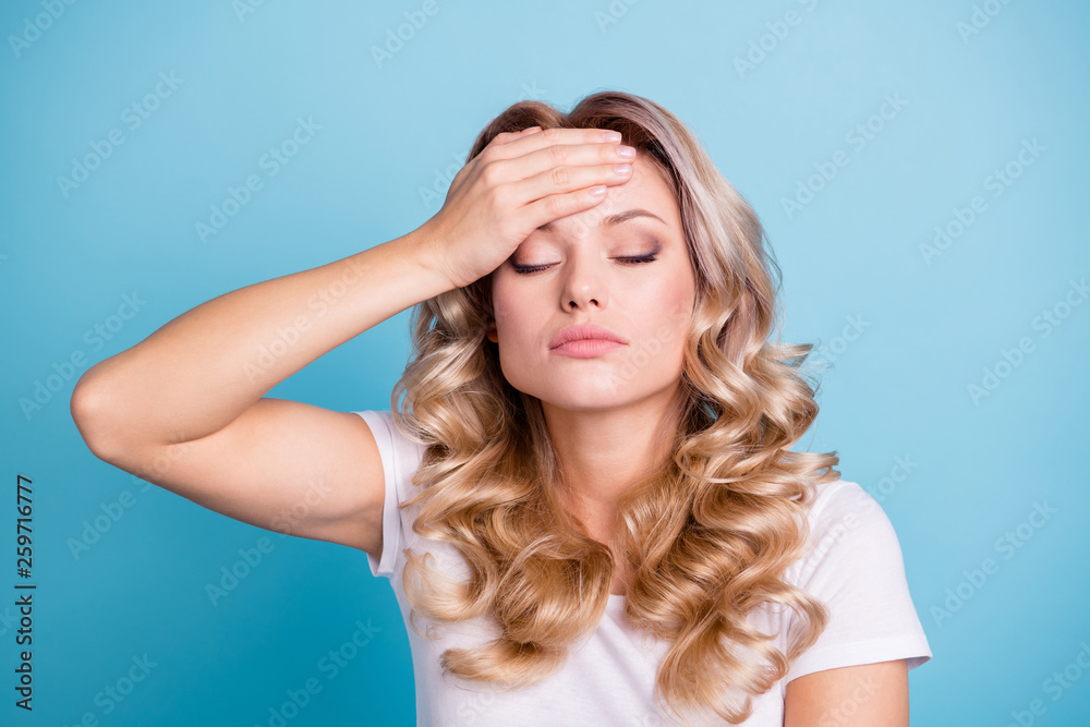 Close up photo beautiful her she lady hand arm lying bad feeling forehead eyes closed tired tension wear casual white t-shirt jeans denim clothes outfit isolated bright blue background