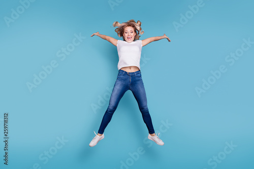 Full length body size view portrait of her she nice lovely attractive cheerful cheery optimistic wavy-haired lady in casual white t-shirt having fun day isolated over blue pastel background