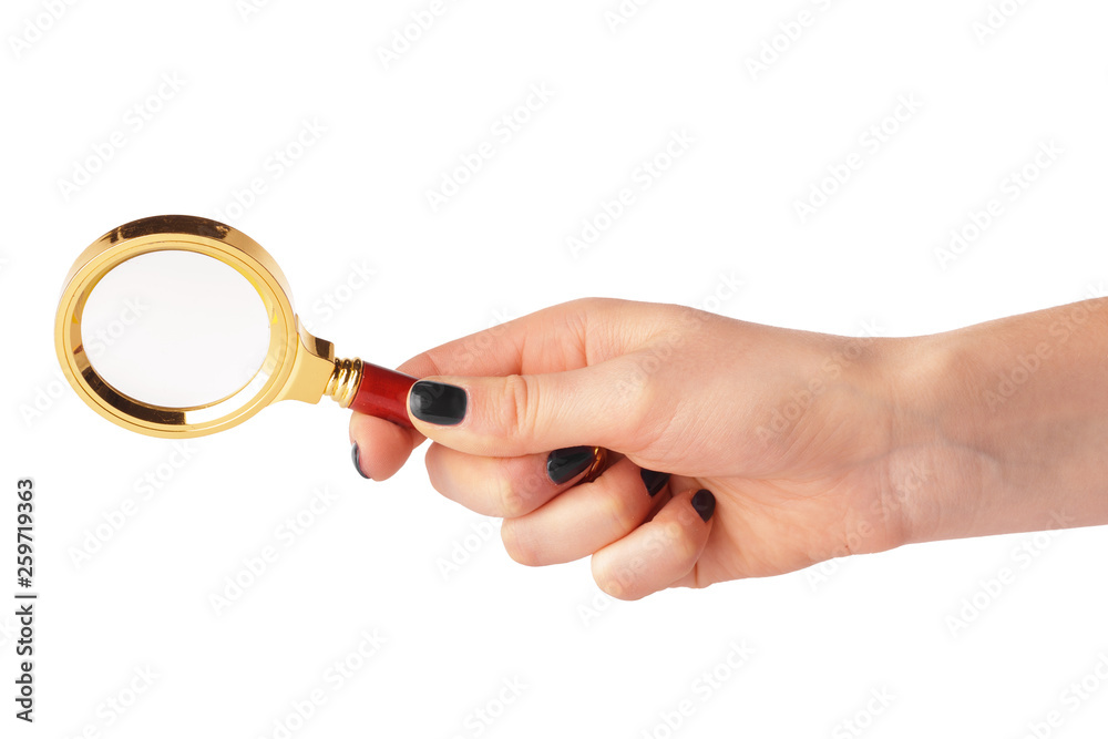 Magnifying glass in a woman hand isolated on white background Magnifying glass in a woman hand isolated on white background