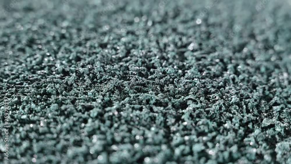 The magnetic field affects iron shavings and powder. Magnet and electricity. Abstraction and texture in gray background. The magnetic field affects iron shavings and powder. Magnet and electricity. Abstraction and texture in gray background.