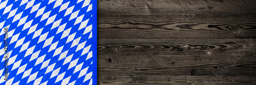 Oktoberfest background. Blue white cloth on wooden table