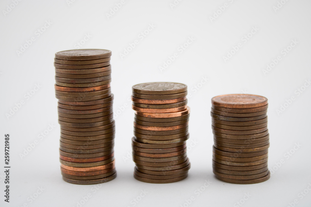 Stack of bronze coins on white background. Coins of five euro cents. Stack of bronze coins on white background. Coins of five euro cents.