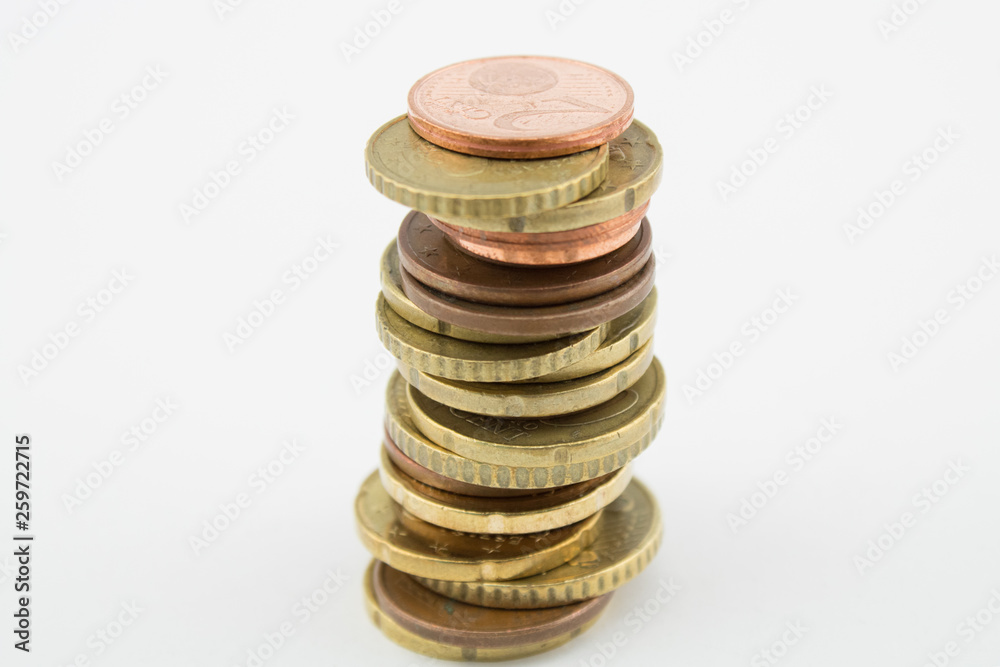 Stack of euro cents coins on white background. Currencies of different values, five, ten and twenty euro cents. Stack of euro cents coins on white background. Currencies of different values, five, ten and twenty euro cents.