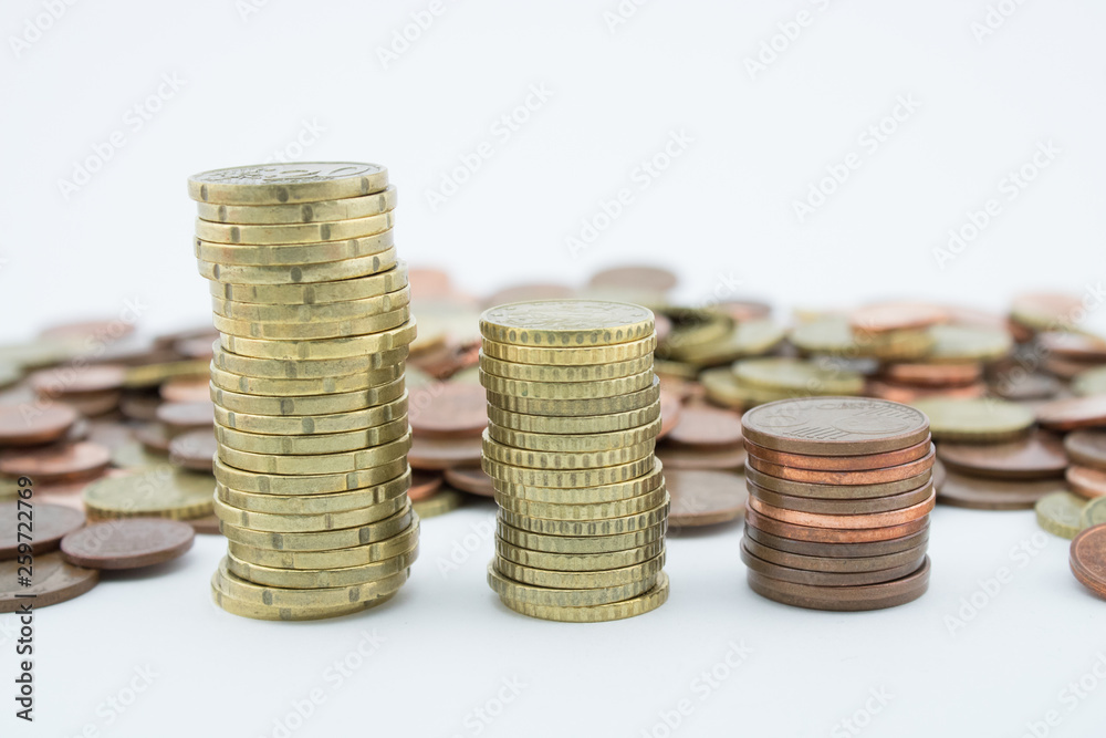 Stack of golden and bronze coins on white background. Coins of twenty euro cents Stack of golden and bronze coins on white background. Coins of twenty euro cents