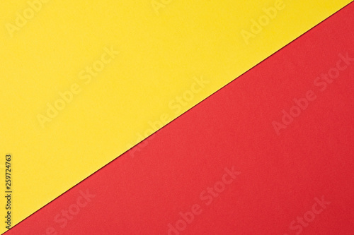 Abstract background The texture of the plastic surface in red and yellow. Two-color background