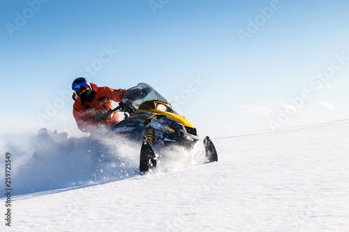 Athlete on a snowmobile. photo