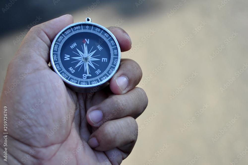 Holding Navigation Compass Holding Navigation Compass