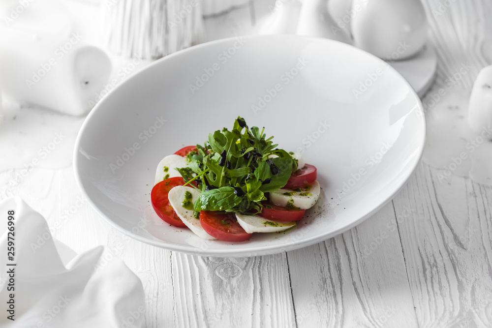 Fresh tasty salad made of tomatoes and cheese Fresh tasty salad made of tomatoes and cheese