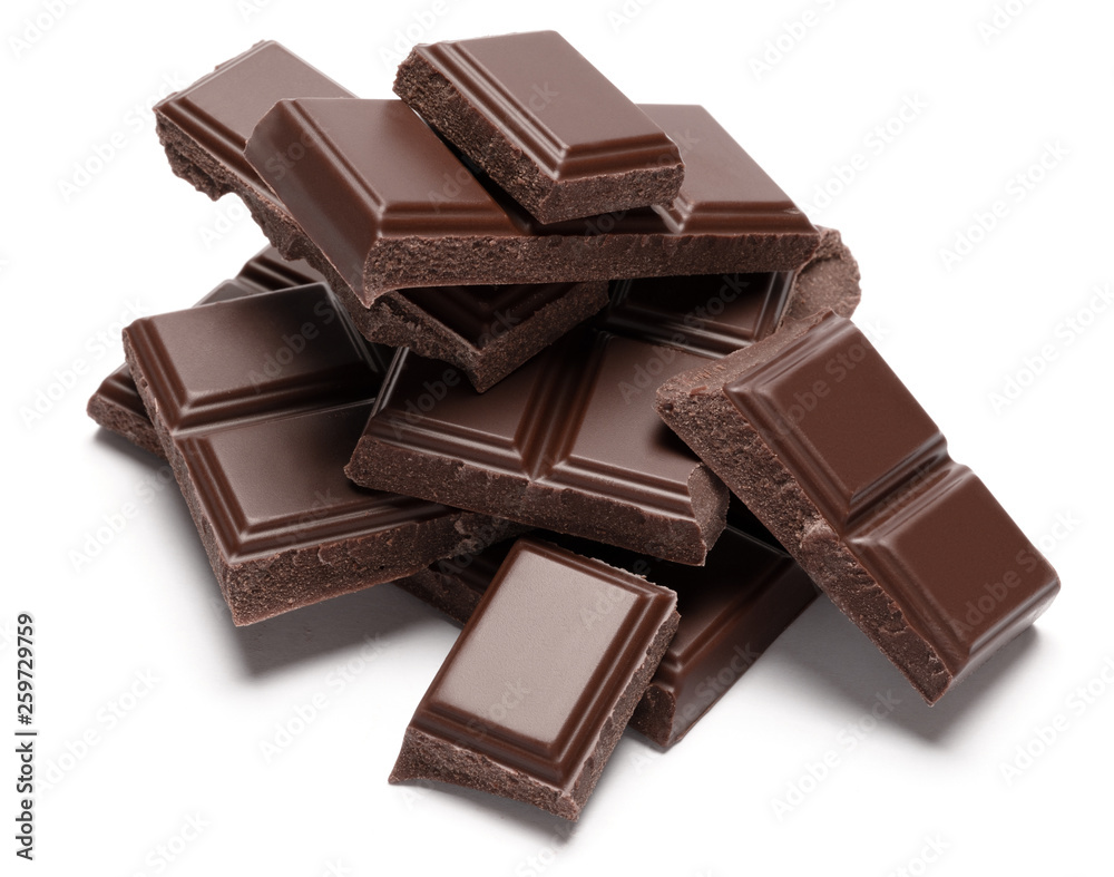 Dark organic chocolate pieces isolated on white background Dark organic chocolate pieces isolated on white background