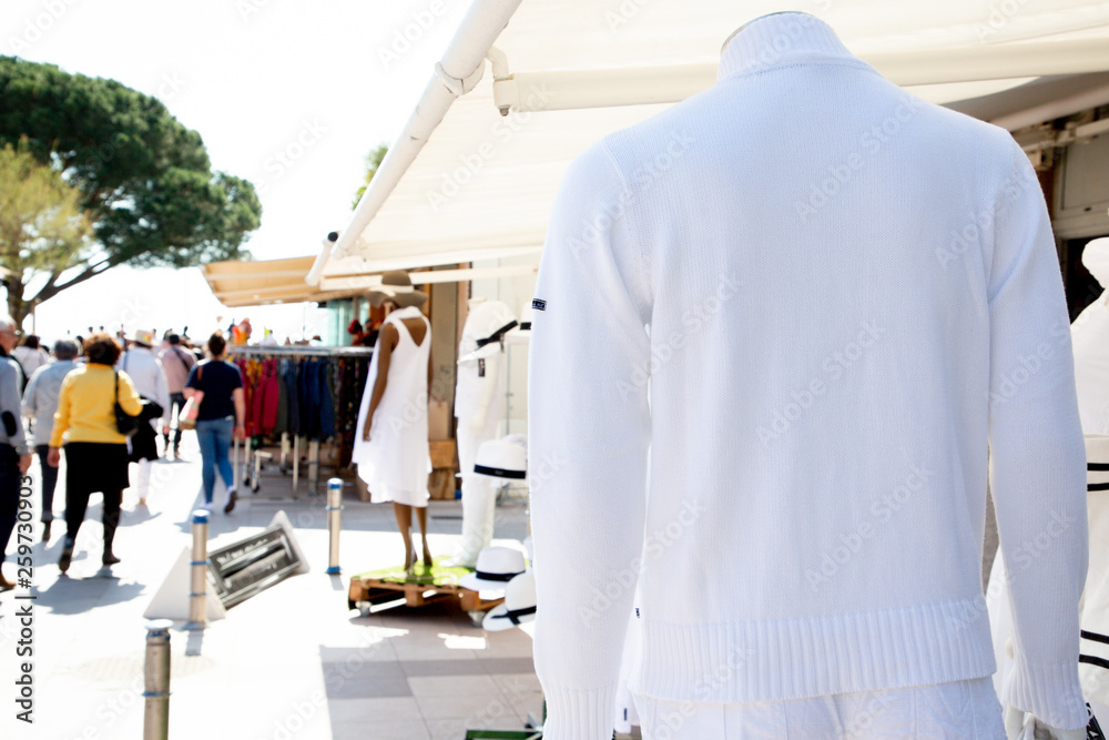 Blank white sweater shirt on shop sale market background with copy space fror your text and advertising Blank white sweater shirt on shop sale market background with copy space fror your text and advertising
