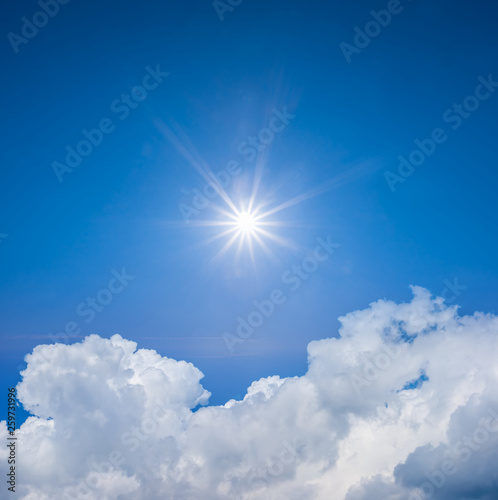 sparkle sun on a cloudy summer sky background