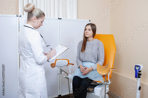 Young woman patient with gynecologist.