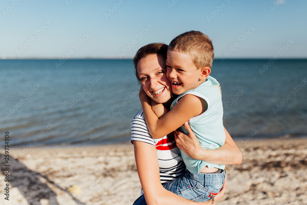 Funny portrait of a happy family on the beach.