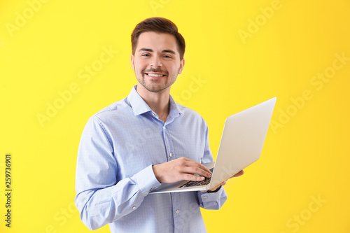 Male programmer with laptop...